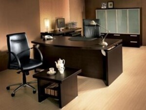 This stylish L-shaped office desk in a rich dark brown finish offers a perfect blend of functionality and elegance for modern workspaces. Designed to maximize corner space, it provides a spacious work surface ideal for multitasking, meetings, or organizing documents. The sturdy construction ensures durability, while the smooth surface adds a touch of sophistication.